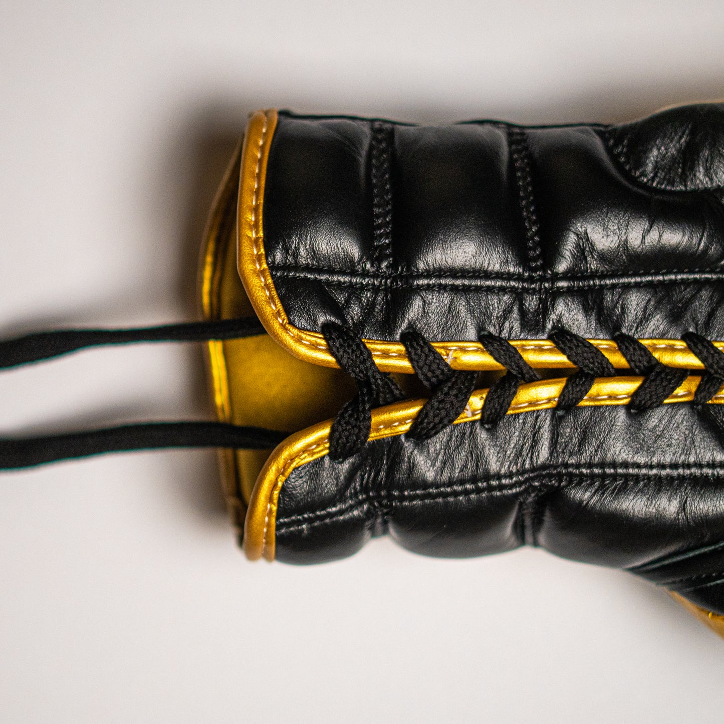 Boxing gloves with laces.